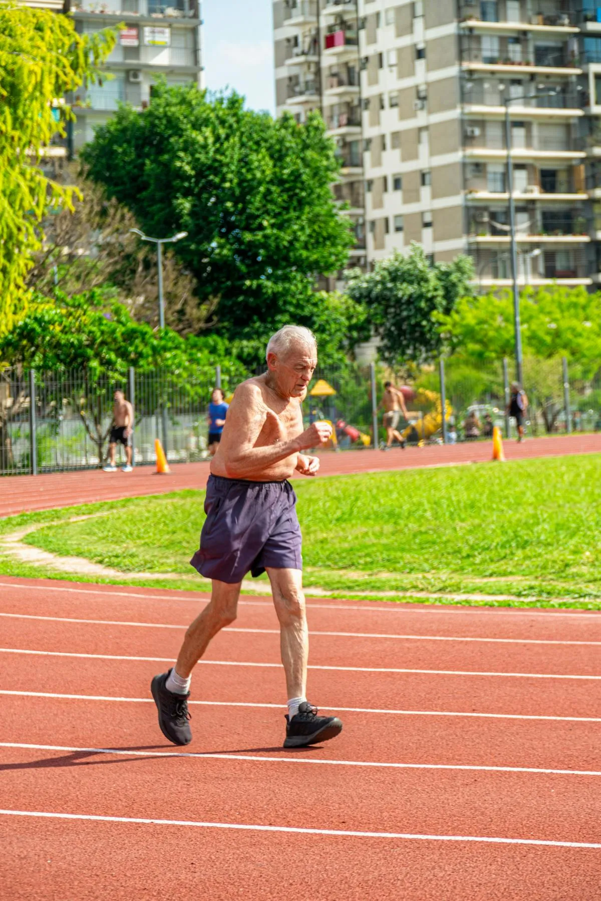 Buder started running at age 48 with no athletic background. By 52 she had run the Boston Marathon; by 55, her first Ironman. The slow building phase was 7 years of unstructured, unglamorous reps.