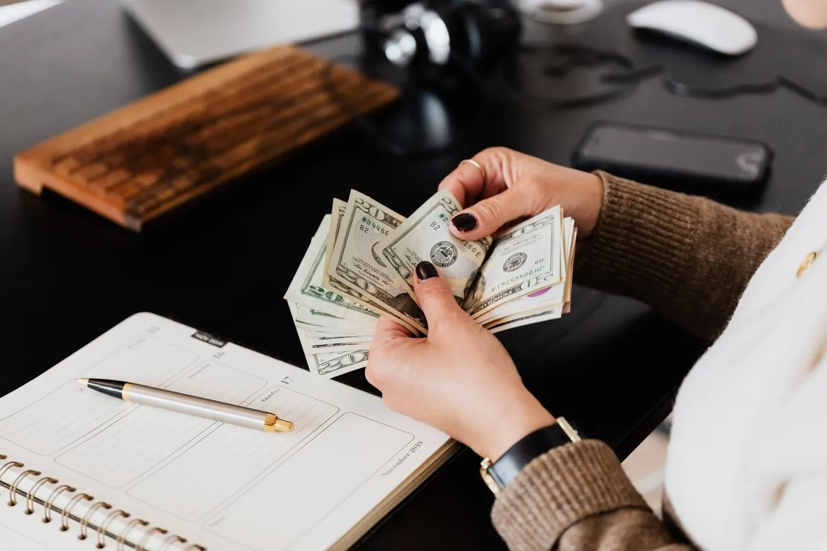 High-yield savings, no debit card, separate institution. Friction is a feature, not a bug.