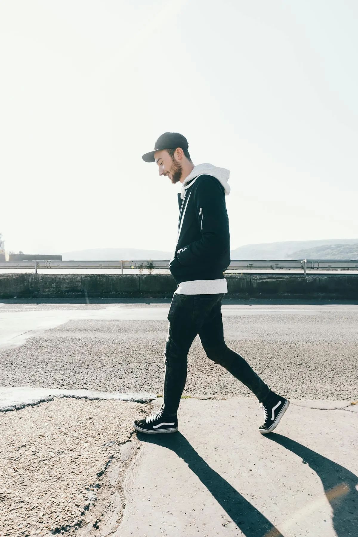 A person walking outside on a sunny day, taking a small, easy first step