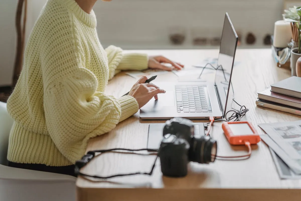 Someone working calmly at a tidy home desk, because to-do list overwhelm is cognitive load, and load is a solvable engineering problem